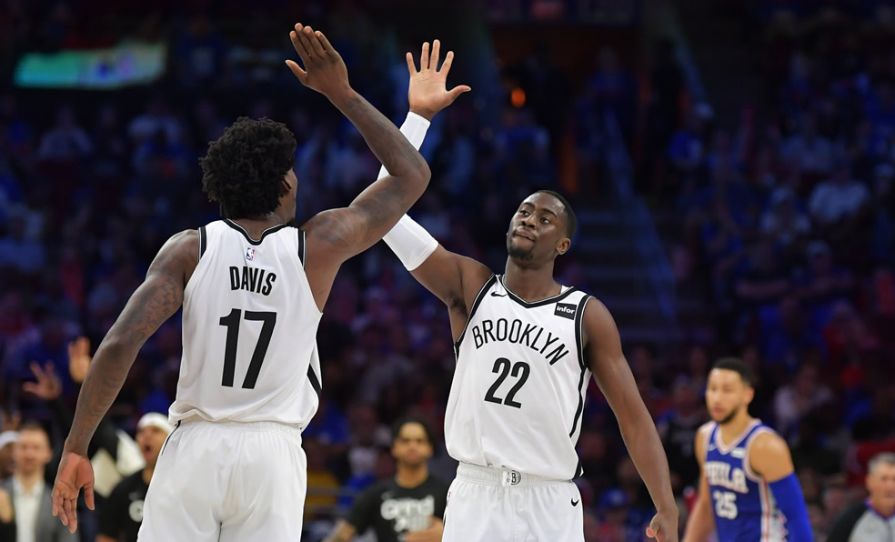 Ed Davis #17 and Caris LeVert #22 of the Brooklyn Nets celebrate