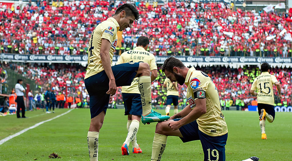 Oribe Peralta y Miguel Layún fueron campeones juntos en América en 2014. (Mexsport)