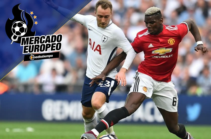 Pogba y Eriksen en una lucha que no se destraba en el mercado de fichajes. AFP