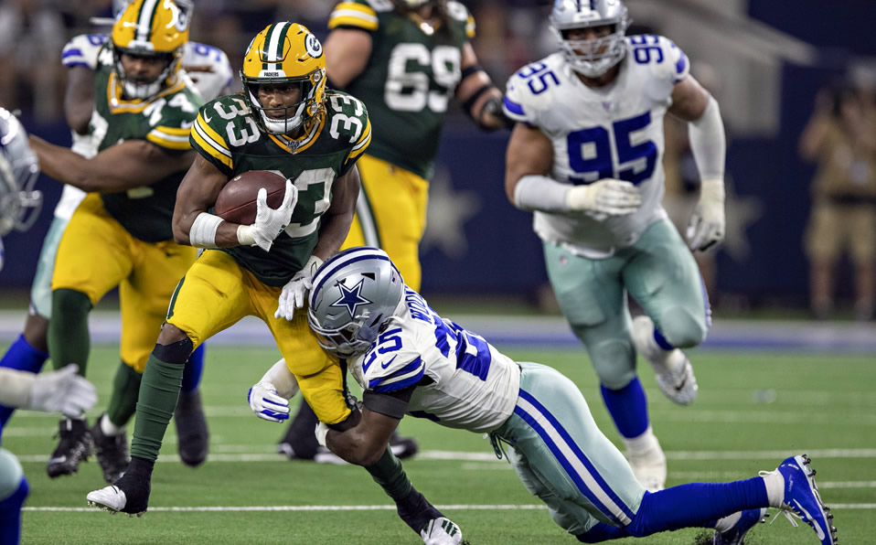 Aaron Jones empató un récord de Green Bay de TD's terrestres en un juego. (AFP)