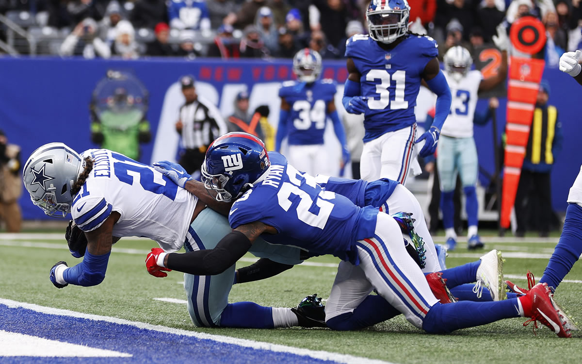 Ezekiel Elliott anotó un touchdown en el triunfo de Dallas ante New York. (AFP)