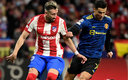 Héctor Herrera y Cristiano Ronaldo en el juego de la Champions. (AFP)