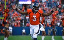 Russell Wilson firmó con Broncos una extensión que lo mantendrá siete años en el equipo. (AFP)