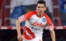 Chucky Lozano con el Napoli calentando en partido de Champions. (Reuters)