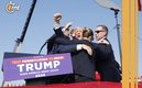Donald Trump es protegido por su cuerpo de seguridad (AFP)
