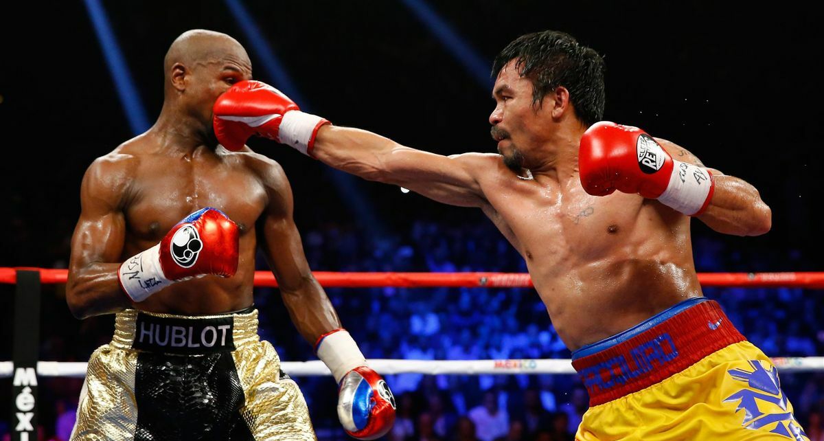 Pacquiao y Mayweather sostuvieron su único combate en 2015 (AFP)